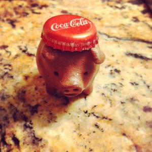 Three legged pig with Coke-a-Cola hat