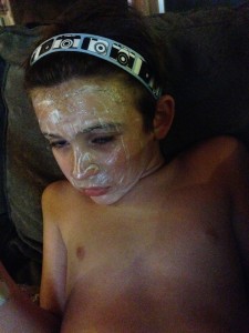 The Boy masking.